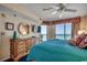 Relaxing main bedroom with ocean views, private balcony access, a dresser, mirror, and a TV at 3601 S Ocean Blvd. # 8-C, North Myrtle Beach, SC 29582