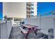 A charming picnic area with a grill and plenty of space for outdoor dining and entertaining at 3601 S Ocean Blvd. # 8-C, North Myrtle Beach, SC 29582