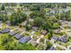 Aerial view of home in established community featuring pool, mature trees, and water features at 370 Foxtail Dr., Longs, SC 29568