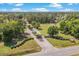 Aerial view showcases the community entrance, lush landscaping and established community at 370 Foxtail Dr., Longs, SC 29568