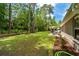 Lush backyard featuring a cozy patio area with outdoor furniture, ideal for relaxation and entertaining guests at 370 Foxtail Dr., Longs, SC 29568