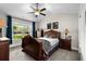 Cozy bedroom featuring a large window, a ceiling fan, and a traditional interior at 370 Foxtail Dr., Longs, SC 29568