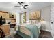 Well-lit bedroom offering study area with custom shelving, a ceiling fan, and an airy ambiance at 370 Foxtail Dr., Longs, SC 29568