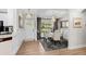 Dining room boasts modern chandelier, wainscotting and open doorway to the kitchen at 370 Foxtail Dr., Longs, SC 29568