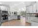 Eat-in kitchen boasts wood floors, stainless appliances, skylights and open living area at 370 Foxtail Dr., Longs, SC 29568