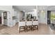 Stylish kitchen with white cabinetry, granite countertops, and bar stool seating at 370 Foxtail Dr., Longs, SC 29568