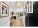 Bright, open-concept living room with soaring ceilings, skylights, and hardwood floors at 370 Foxtail Dr., Longs, SC 29568