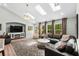 Elegant living room featuring skylights, a fireplace, and plush seating arrangements at 370 Foxtail Dr., Longs, SC 29568