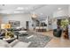 Spacious living area with a large rug, chandelier, and seamless flow to the kitchen at 370 Foxtail Dr., Longs, SC 29568