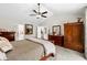 Well-lit main bedroom with ceiling fan and backyard access, adjacent to en-suite bath at 370 Foxtail Dr., Longs, SC 29568
