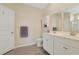 Well-lit bathroom with double sink vanity, white cabinets, and a spacious shower with glass door at 3766 Bells Lake Circle # 3766, Longs, SC 29568