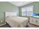 Cozy bedroom featuring a comfortable bed, and a large window that brings in plenty of natural light at 3766 Bells Lake Circle # 3766, Longs, SC 29568
