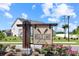Community sign for Bell's Lake is surrounded by colorful flowers at 3766 Bells Lake Circle # 3766, Longs, SC 29568