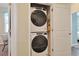 Stacked washer and dryer inside closet provides space-saving convenience at 3766 Bells Lake Circle # 3766, Longs, SC 29568