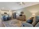 Open concept living space with sofas, kitchen island, stainless steel appliances, and hardwood floors at 3766 Bells Lake Circle # 3766, Longs, SC 29568