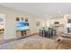 Open concept living space with sofas, kitchen island, stainless steel appliances, and hardwood floors at 3766 Bells Lake Circle # 3766, Longs, SC 29568