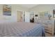 Bright main bedroom featuring a comfortable bed, dresser, and convenient access to the ensuite bathroom at 3766 Bells Lake Circle # 3766, Longs, SC 29568