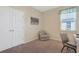 A home office setup with neutral decor, lots of natural light, and chair, perfect for productivity at 3766 Bells Lake Circle # 3766, Longs, SC 29568