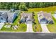 Aerial view of a home with a lush green lawn, beautiful landscaping, and a private backyard at 389 Barton Loop, Myrtle Beach, SC 29579