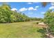 Expansive backyard featuring a well manicured lawn, lake view, and verdant foliage at 389 Barton Loop, Myrtle Beach, SC 29579