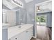 Bathroom featuring a vanity with sink, a large mirror, modern lighting, and access to the main bedroom at 389 Barton Loop, Myrtle Beach, SC 29579