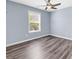 Bedroom featuring wood-look flooring, a ceiling fan, and a bright window at 389 Barton Loop, Myrtle Beach, SC 29579