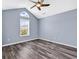 Cozy bedroom with vaulted ceiling, a ceiling fan, and a large window at 389 Barton Loop, Myrtle Beach, SC 29579