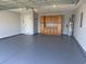Spacious garage featuring epoxy flooring, ample cabinet space, and a water heater at 389 Barton Loop, Myrtle Beach, SC 29579