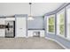 Eat-in kitchen area with a desk, stainless steel refrigerator, and a decorative wall hanging at 389 Barton Loop, Myrtle Beach, SC 29579