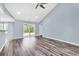 Spacious living room featuring vaulted ceilings, a ceiling fan, and sliding glass doors at 389 Barton Loop, Myrtle Beach, SC 29579