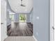 Open living room with modern vinyl floors, neutral walls, and sliding glass doors to the backyard at 389 Barton Loop, Myrtle Beach, SC 29579