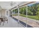 Screened porch overlooking landscaped backyard with a pond view at 389 Barton Loop, Myrtle Beach, SC 29579