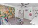 The fun bedroom features white furniture, a ceiling fan, and comic book decor at 396 Emery Oak Dr., Murrells Inlet, SC 29576