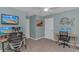 The large bedroom features a ceiling fan, neutral walls, and multi-monitor computer setup at 396 Emery Oak Dr., Murrells Inlet, SC 29576