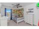 The fun bedroom features white furniture, a ceiling fan, and comic book decor at 396 Emery Oak Dr., Murrells Inlet, SC 29576