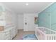 Bright Bedroom featuring mermaid-themed wall art, a crib, and aqua-colored decor at 396 Emery Oak Dr., Murrells Inlet, SC 29576