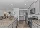 Modern kitchen with granite countertops, stainless steel appliances, and a seamless connection to the dining area at 396 Emery Oak Dr., Murrells Inlet, SC 29576
