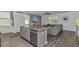 Open-concept kitchen with island, stainless steel appliances, flowing seamlessly into the living room for easy entertaining at 396 Emery Oak Dr., Murrells Inlet, SC 29576