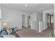 Bright loft space with neutral carpet and walls with access to several rooms at 396 Emery Oak Dr., Murrells Inlet, SC 29576