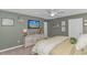 Inviting main bedroom with king bed, ceiling fan, and decorative wall art at 396 Emery Oak Dr., Murrells Inlet, SC 29576