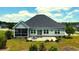 Aerial view of the home showcasing a backyard with lush greenery, patio area, and a well-maintained lawn at 4008 Tupelo Ct., Conway, SC 29526