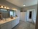 Bathroom with a double vanity sink, neutral walls, and tile floors at 4008 Tupelo Ct., Conway, SC 29526