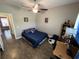 Comfortable bedroom featuring a ceiling fan, hardwood floors, and a minimalist style for relaxation at 4008 Tupelo Ct., Conway, SC 29526