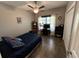 Bedroom with wood-look floors has a dark bedspread and a ceiling fan at 4008 Tupelo Ct., Conway, SC 29526