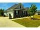 This home boasts dark brick with grey siding, a well manicured yard, and a two car garage at 4008 Tupelo Ct., Conway, SC 29526