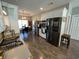 Modern kitchen with stainless steel appliances, white cabinets, wood floors, and a view to the dining area at 4008 Tupelo Ct., Conway, SC 29526