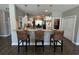Kitchen island with bar stool seating, pendant lighting, and views of the appliances and dining area at 4008 Tupelo Ct., Conway, SC 29526
