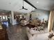 Spacious living room with vaulted ceilings, hardwood floors, comfortable seating, and an open floor plan at 4008 Tupelo Ct., Conway, SC 29526
