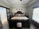 Bright main bedroom with a ceiling fan, wood floors, and neutral walls at 4008 Tupelo Ct., Conway, SC 29526