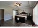 Spacious main bedroom features a trey ceiling, a ceiling fan, and an ensuite bathroom at 4008 Tupelo Ct., Conway, SC 29526